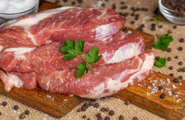 Raw fresh meat. Raw pork steak on a wooden board.