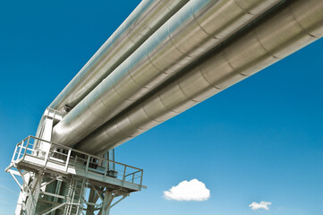 Pipeline against the blue sky and clouds, bottom view