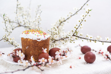 Colorful Easter eggs with spring blossom flowers. Colored Egg Holiday border. Easter cake