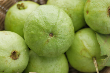 close up of slice of guava on table 