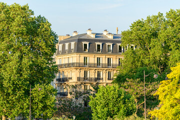 A Hausmann building, in Europe, in France, in ile de France, in Paris, in summer, on a sunny day.