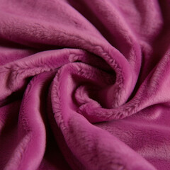 Fototapeta na wymiar A soft magenta fleece fabric its texture soft and warm. Trendy color of 2023 Viva Magenta.. AI generation.