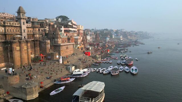 Aerial view of the Varanasi ghats on the banks of the sacred Ganges river at sunrise in Varanasi, Uttar Pradesh, India.