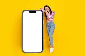 Photo of pretty lady interested look booking delievery service present big device panel empty space isolated on yellow color background