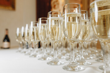 Empty clean champagne glasses on counter in bar.