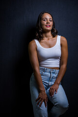 Close up image of a Dark Haired Girl Posing for a Fashion Shoot in a studio