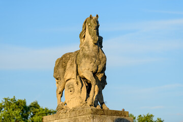 A statues of the Pont de Iena , in Europe, in France, in Ile de France, in Paris, At the edge of the Seine, in summer, on a sunny day.