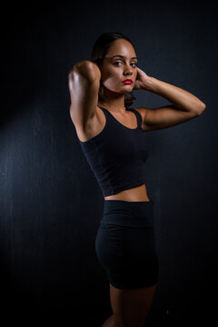 Close up image of a Dark Haired Girl Posing for a Fitness Photo shoot