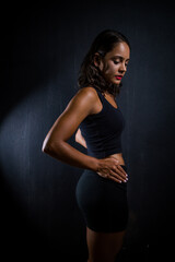 Close up image of a Dark Haired Girl Posing for a Fitness Photo shoot