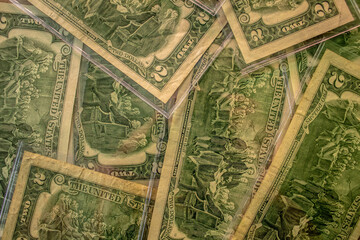 Fototapeta premium View of back of 2 dollar bills, background.