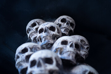 Skull Halloween Background Many People Skulls Stand on top of each other. Mystic creepy concept. Abstract nightmare occult memorial