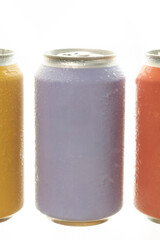 Three colorful drink cans