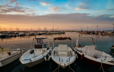 Port with moored yachts and boats.