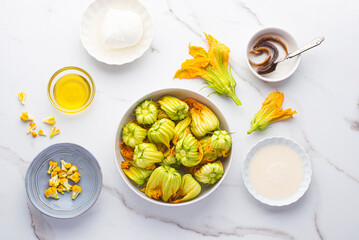 
 Blossoms flowers zucchini (Courgette, Squash Flowers) or Fiori di zucca and ingredients for...