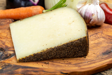 Cheese collection, aged hard Italian sheep cheese black pecorino from Sicily island or pecorino nero di Sicilia