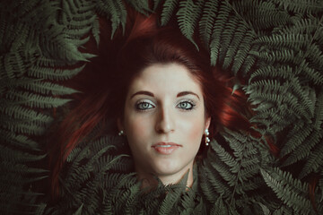 Woman portrait with ferns. Ready for bookcover