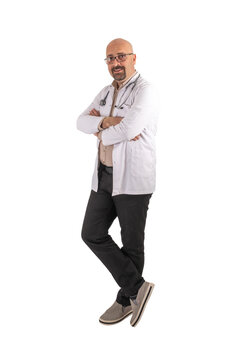 Trustworthy handsome bald middle aged full body shot male doctor. Transparent png image, Relax, smiling, confident physician wearing coat and stethoscope. Arms crossed proud concept.