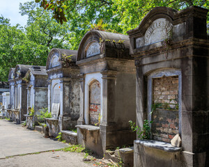 A row of weathered tombs in New Orleans' Lafayette Cemetary
