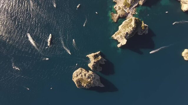 Aerial video of Fraglioni off the coast of Capri, Italy