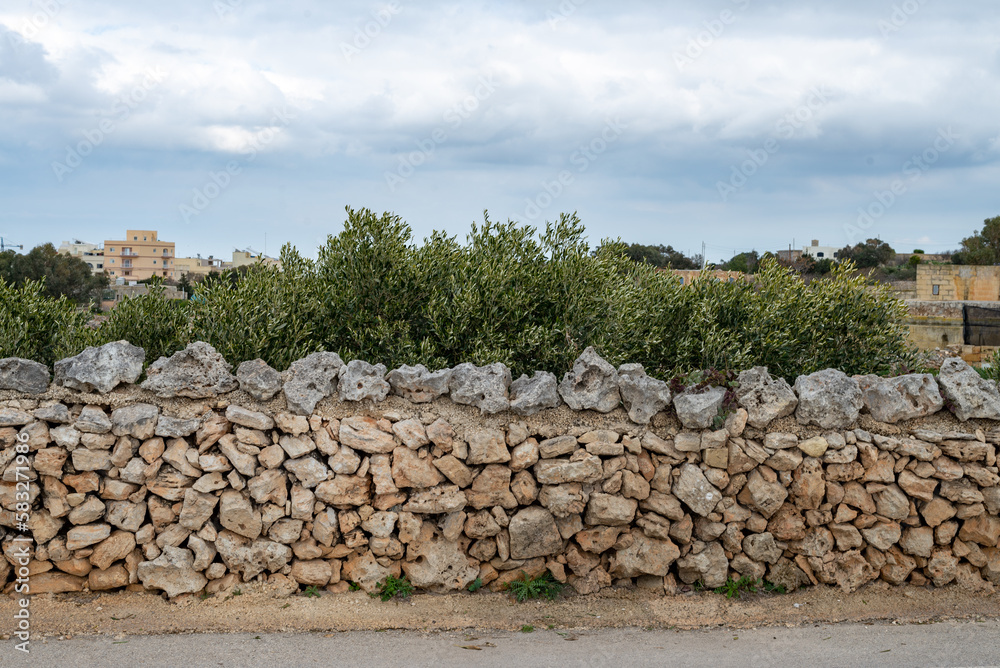 Wall mural a wall built with stone in malta