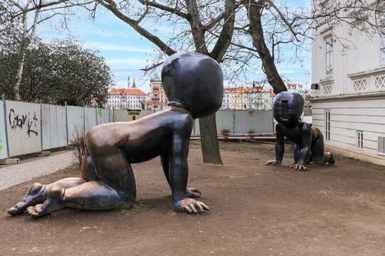 Prague, Czech Republic - February 23, 2023: Famous sculpture Crawling Babies by David Cerny installed outdoors in Kampa Park museum