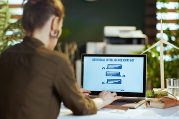 Seen from behind business woman using customer service