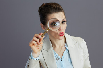 surprised 40 years old business woman in light business suit