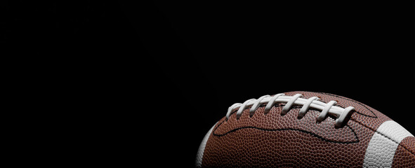 American football ball close up on black background. Horizontal sport theme poster, greeting cards, headers, website and app