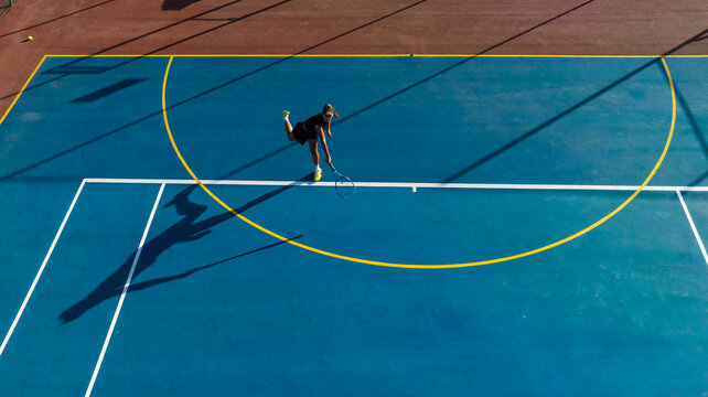 Drone Shot of Young Female Tennis Player on a New Court