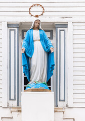 Fairbanks, Alaska, USA - July 27, 2011: Closeup, Virgin Mary statue above entrance to historic...