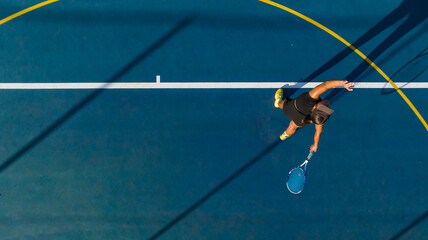 Drone Shot of Young Female Tennis Player on a New Court