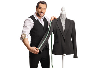 Tailor measuring a sleeve from a suit on a mannequin torso