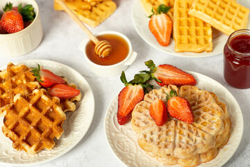 set of different waffles with strawberries