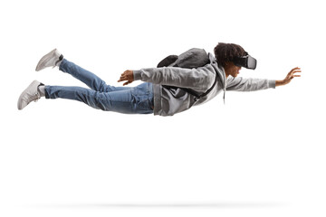Full length shot of an african american male student flying with a vr headset