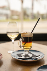 irish coffee with a glass of wine in a restaurant