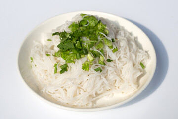 Rice noodles with spring onions and chopped coriander