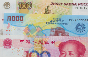 A Chinese Yuan Note With A Russian Ruble And A Central African Franc Bank Note