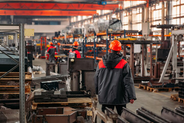 Workers in large industrial warehouse