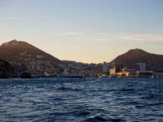 The marina of Cabo San Lucas is bustling with yachts andglass bottom boats buzzing to and from the...