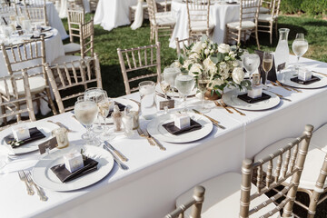 set tables waiting for the guests of the wedding ceremony