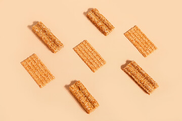 Composition with tasty sesame kozinaki on color background