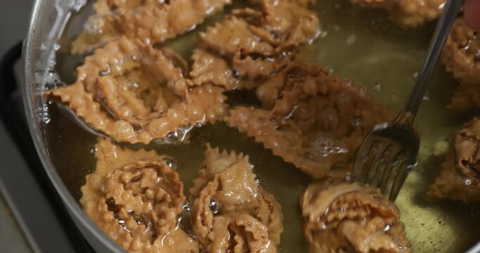 Fried to perfection: chebakia undergoes a transformation, becoming a crunchy, golden masterpiece