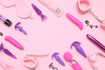 Frame made of sex toys on pink background