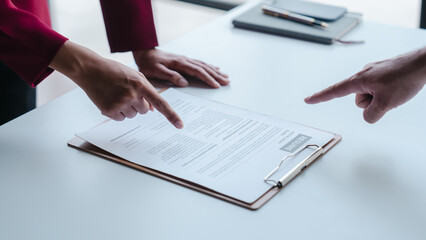 Close up view of job interview with applicant with resume paper in office, Recruitment, Job application concept.