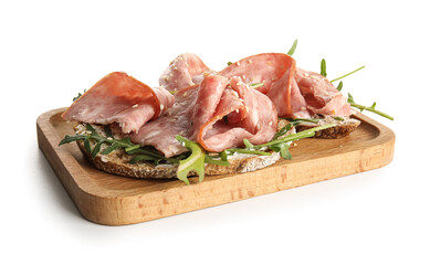 Wooden board of tasty bruschettas with ham isolated on white background