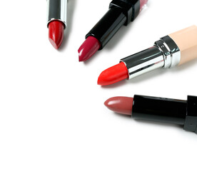 Fototapeta premium Set of different lipsticks on white background