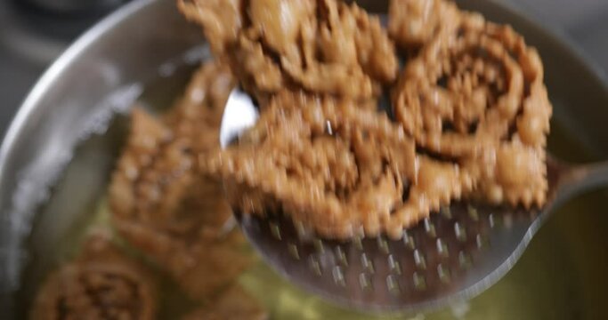 The frying finale: a visual feast as chebakia turns from soft dough to crispy perfection, ready to delight palates.