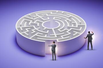 Businessman trying to find a way out of maze