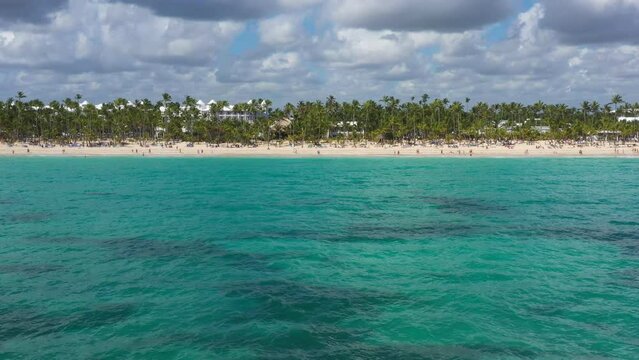 Pristine and bounty shore. Arena Gorda beach with resorts. People faving fun on caribbean coastline. Aerial view from drone