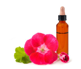 Geranium flowers with bottle with essence